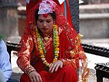 Kathmandu Patan 04 Kumbeshwar Temple 03 Hindu Wedding Ceremony Bride Close Up The Nepalese Hindu bride was dressed in a heavily embroidered red sari, beautifully made up, and wearing much jewelry at the Kumbeshwar Temple in Patan.